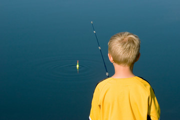 Boy Fishing with Bobber © Mike Eikenberry
