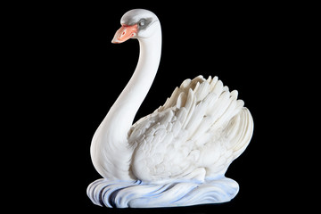 Classic painted marble statuette of swan isolated on black © Mrakor