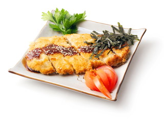 Meat baked in batter and rusk, parsley, tomato