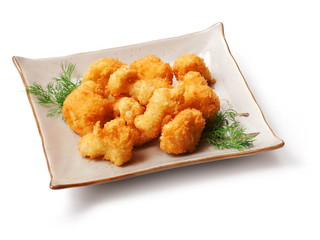 Meat fried in batter, dill in squared plate