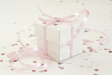 White gift with pink bow