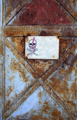 Skull plate on a rusty background