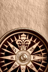 Compass on the old paper