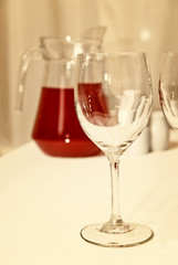 glass goblet and red beverage on the table