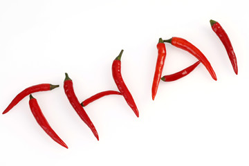 Obraz premium Chilis arranged to form the word THAI