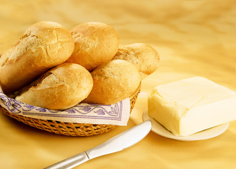 baguettes in a basket and butter brick