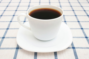 Cup of coffee on table.