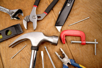 Assorted tools on wooden surface