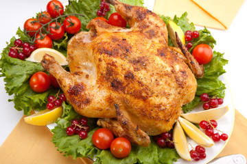 Whole roasted chicken on table