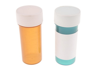 Two plastic pill containers isolated on white