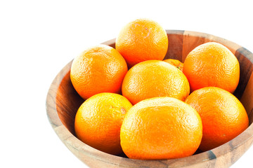 wood dish full with oranges
