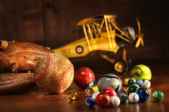 Old baseball and glove with antique toys