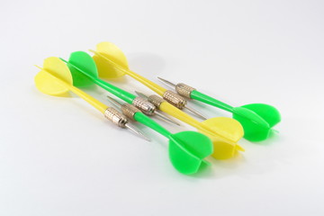 Multi-coloured darts on a white background