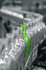 Different unique green bottle in factory line