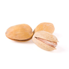 Fototapeta premium Closeup of pistachio nuts on white with clipping path