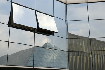 Glass facade with geometric reflections