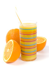 glass of juice and oranges