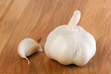garlic on a wooden kitchen board