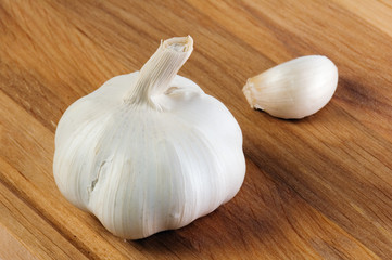 garlic on a wooden kitchen board