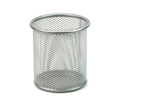 Empty metal basket on white