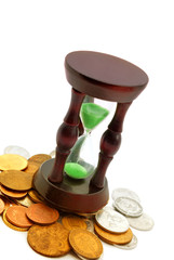 sand watch and background of coins