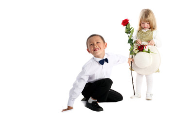 little boy with rose and girl isolated on white