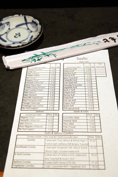 Sushi menu and chopsticks