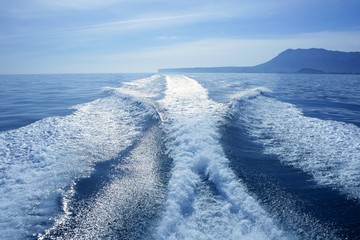 Boat white wake on the blue ocean sea - Powered by adobe