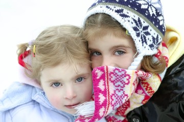 Two little girls with wool winter hat