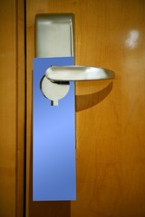 Hotel door handle with a copy space note