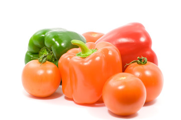 Paprika and tomatoes on white background