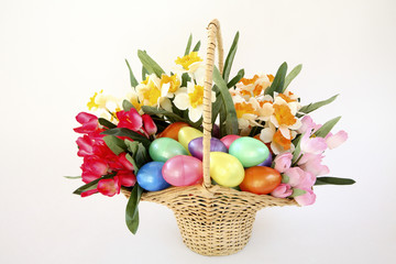 Obraz na płótnie Canvas Easter basket of flowers and eggs.