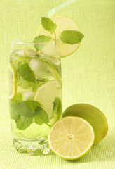 Mojito cocktail on green background