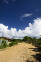 Unmade earth road in a village Dominican republic
