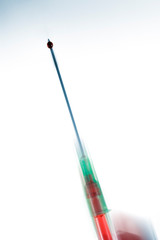 Syringe needle with blood drop