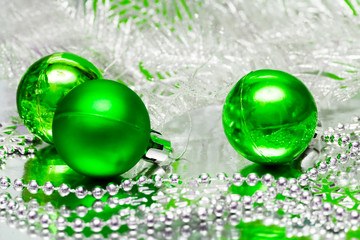 green Christmas balls with silver tree - Powered by Adobe