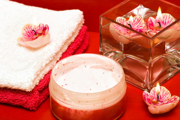 spa essentials (cream, towel and candles)