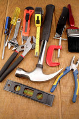 Assorted tools on wooden surface