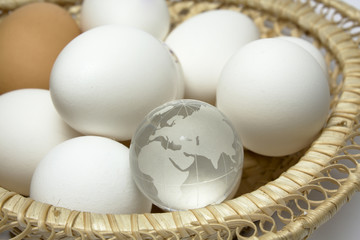 Basket with eggs and globe