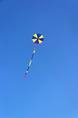 handmade kite flying on a clear blue sky