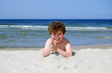 Boy playing on beach