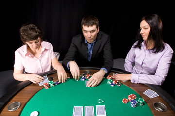 Group of friends playing poker