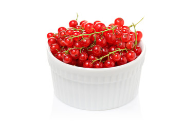 A bowl with soft fruit isolated on white background