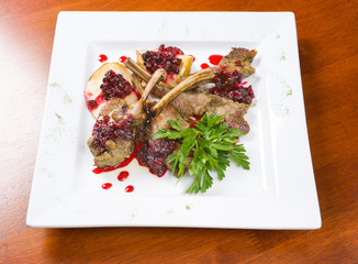 meat lamb on rib with cowberries by sauce