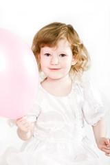 Cute little girl with an air balloon