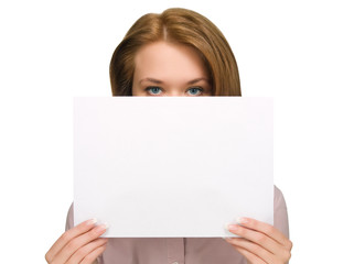 pretty girl hiding under sheet of paper