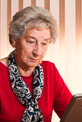 Senior Business Lady at Computer