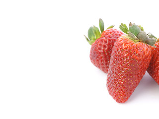Strawberries over white background