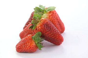 Strawberries over white background