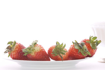 Strawberries over white background